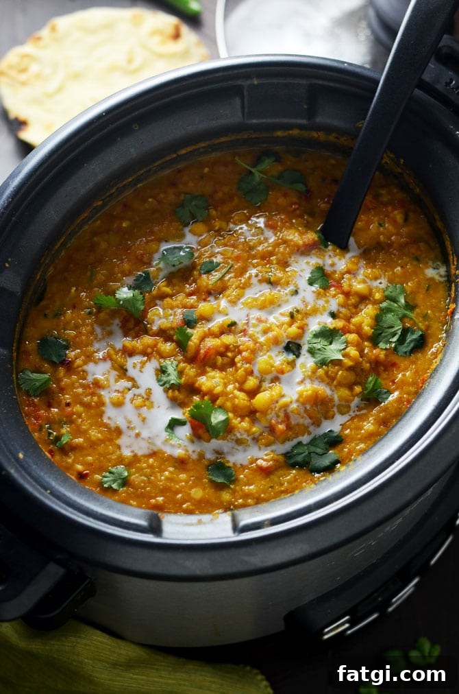Slow Cooker Indian-Spiced Lentils. This crock pot dahl recipe is hearty, heavily spiced, and ultra-comforting. It doesn't require any crazy techniques, but winds up so flavorful! | hostthetoast.com