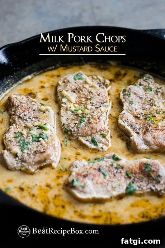 Juicy Pork Chops Braised in Milk with Mustard Sauce Juicy Pork Chops Braised in Milk with Mustard Sauce in a cast iron skillet