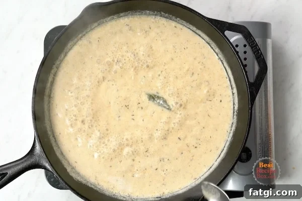 Juicy Milk Braised Pork Chops with Mustard Sauce 6 Sauce being made in the same skillet