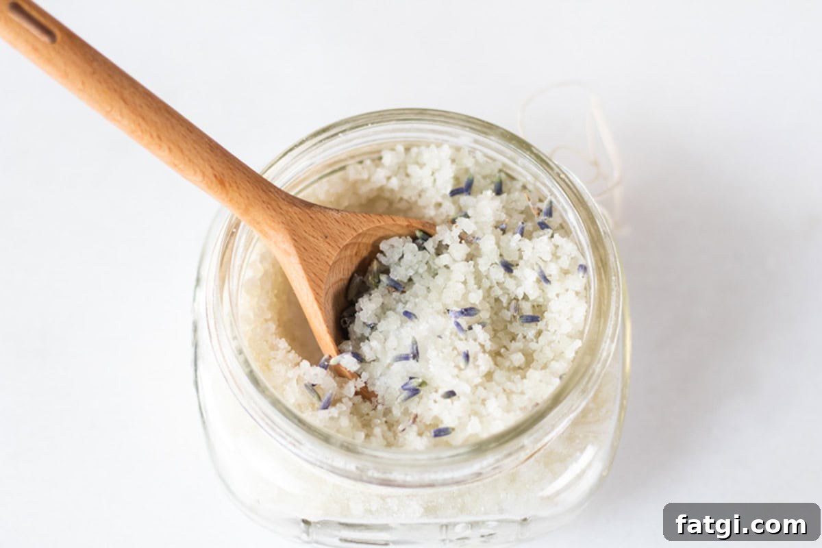 Detox Foot Soak Recipe for Tired Aching Feet 2 A jar of detoxifying foot bath with a wooden spoon sticking out of it.