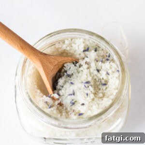 Detox Foot Soak Recipe for Tired Aching Feet 12 A jar of detoxifying foot bath with a wooden spoon sticking out of it.