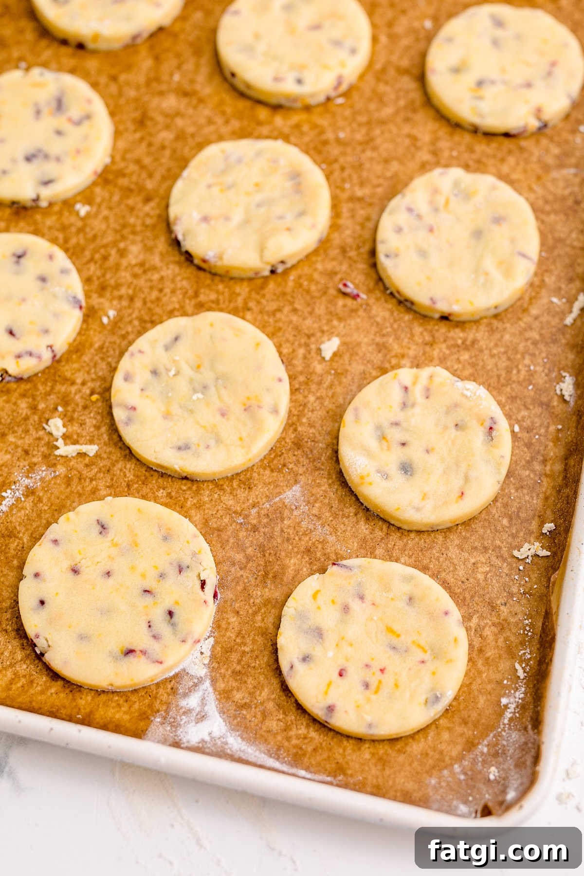 Cookies on a baking sheet with parchment paper.