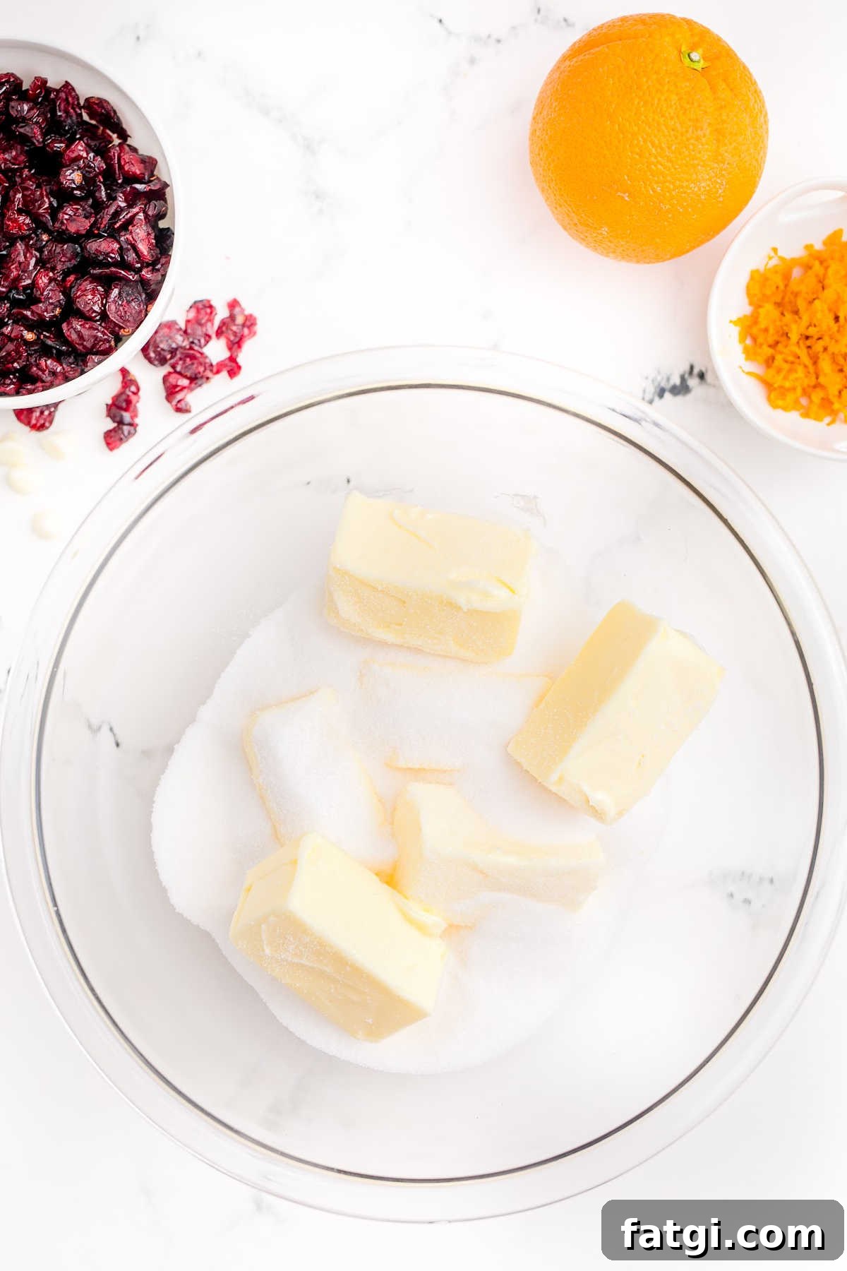 Butter and sugar in a large mixing bowl.
