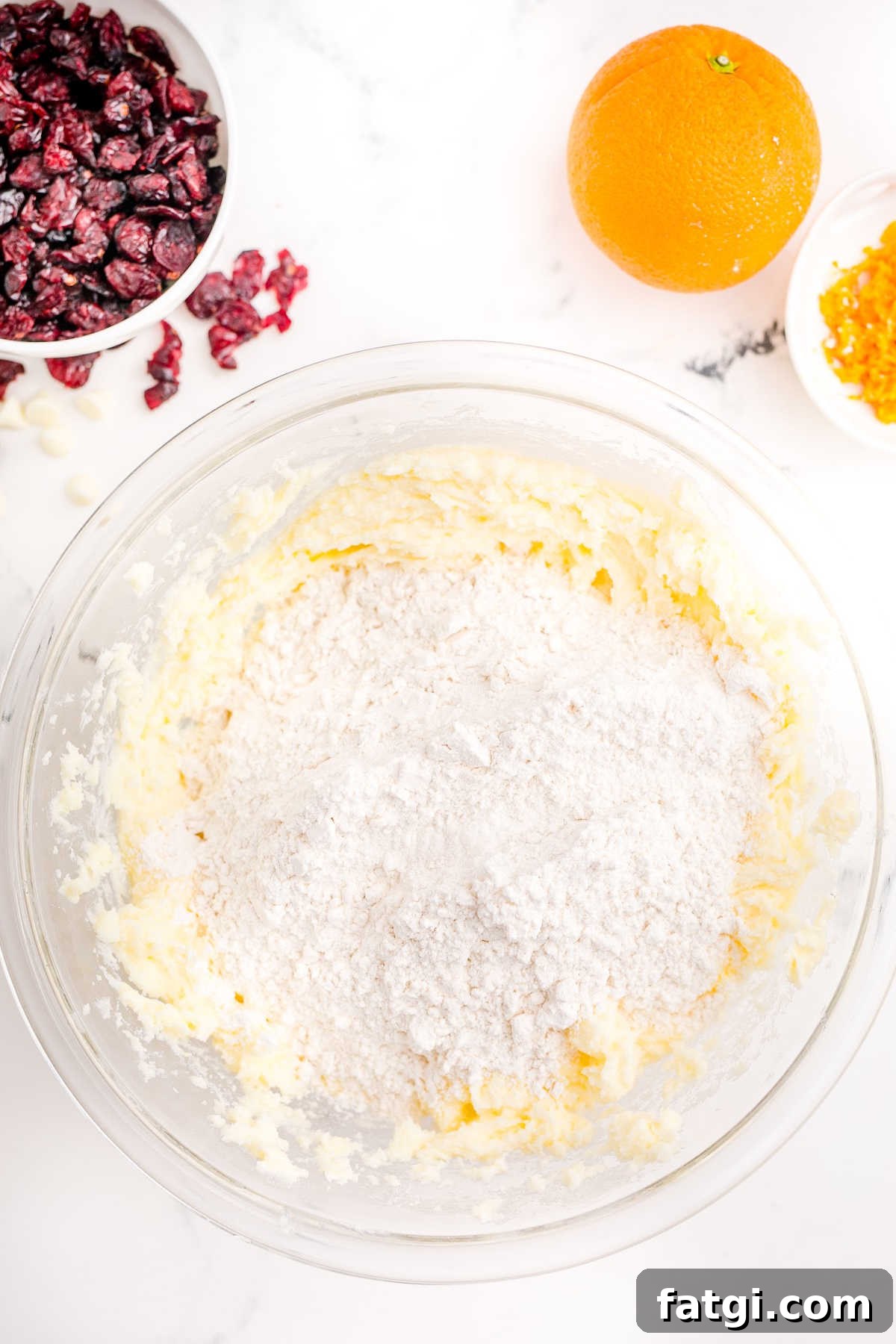 A flour mixture being added to a butter mixture.