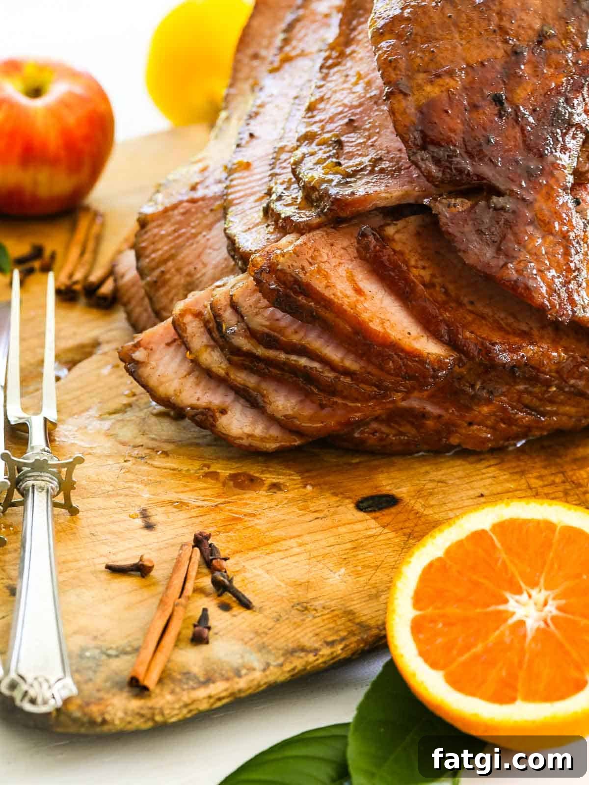 A big juicy sliced ham on a cutting board ready to eat