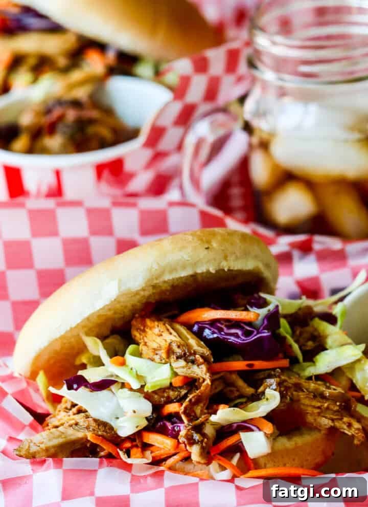 Pulled pork sandwich topped with coleslaw