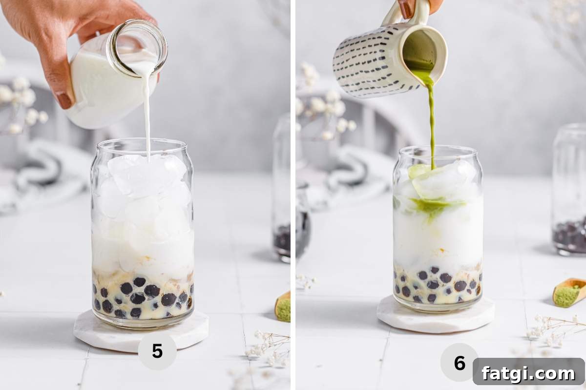 Pouring in milk and green tea in the serving cup.