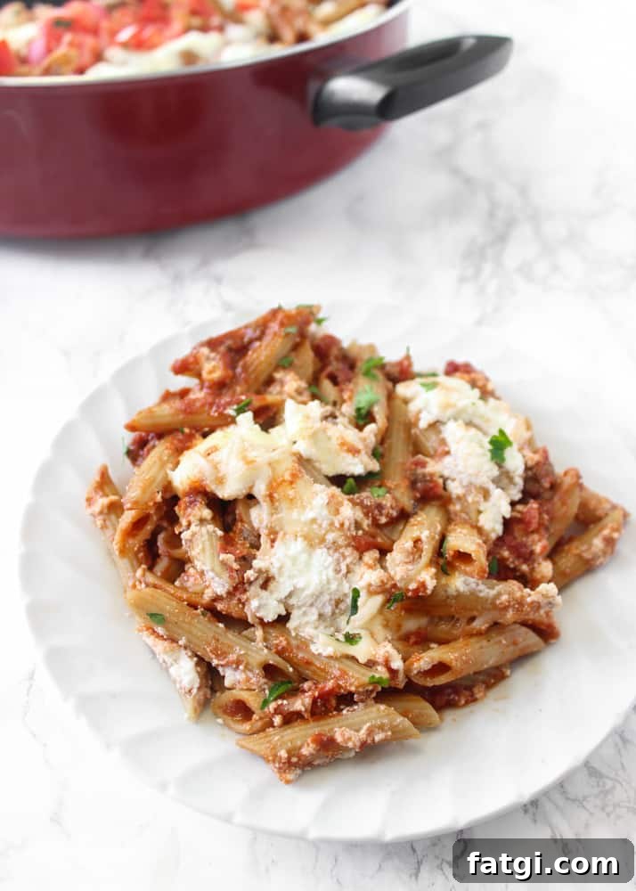 Serving of cheesy one-skillet baked ziti with whole-grain pasta, ricotta, and mozzarella