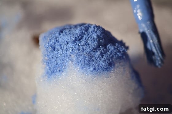 painting snow balls with homemade snow paint