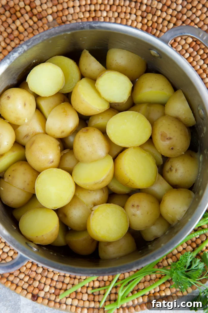 baby Yukon gold potatoes in a pot after being parboiled