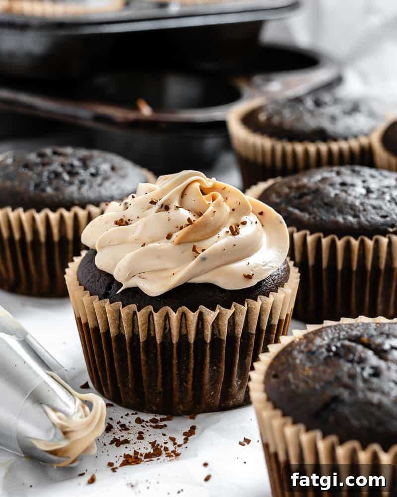 Mocha Coffee Cupcakes with Espresso Frosting 2 completed Easy Coffee Cupcakes on a white surface
