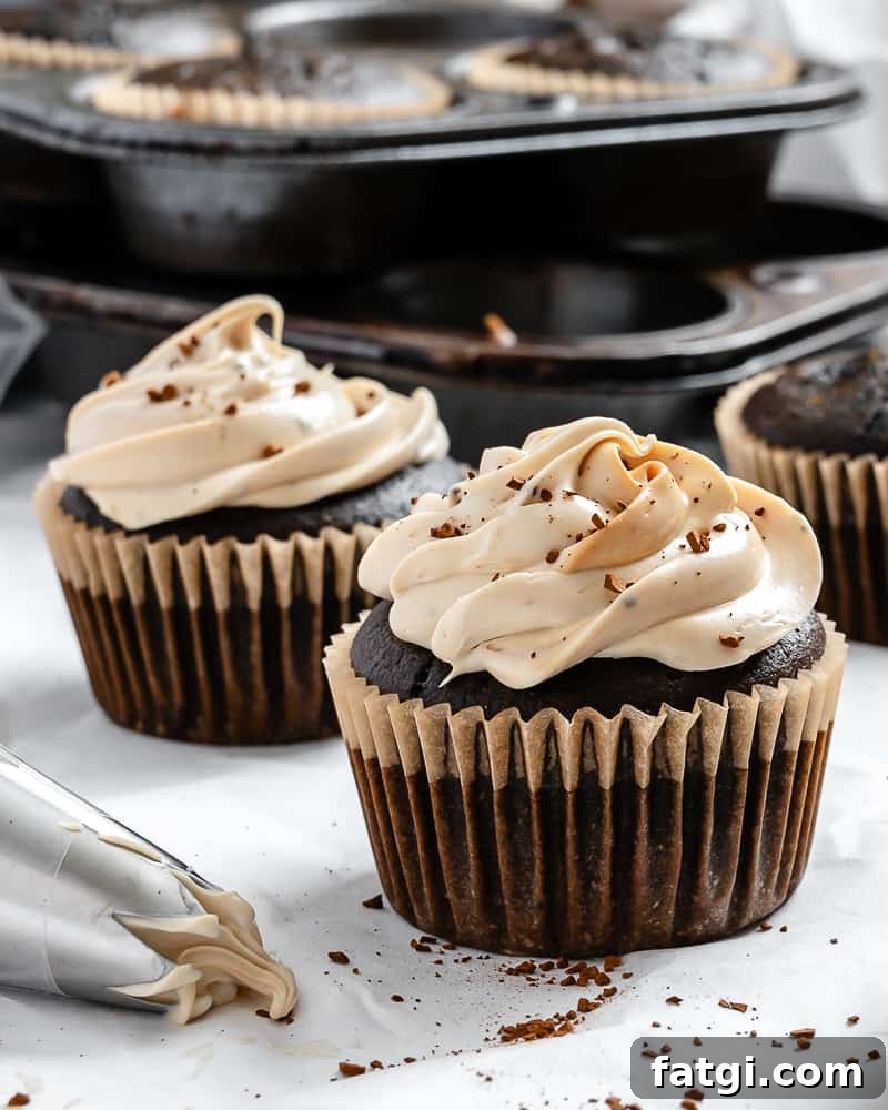 Mocha Coffee Cupcakes with Espresso Frosting 9 completed Easy Coffee Cupcakes on a white surface