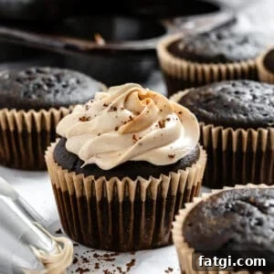 Mocha Coffee Cupcakes with Espresso Frosting 11 completed Easy Coffee Cupcakes on a white surface