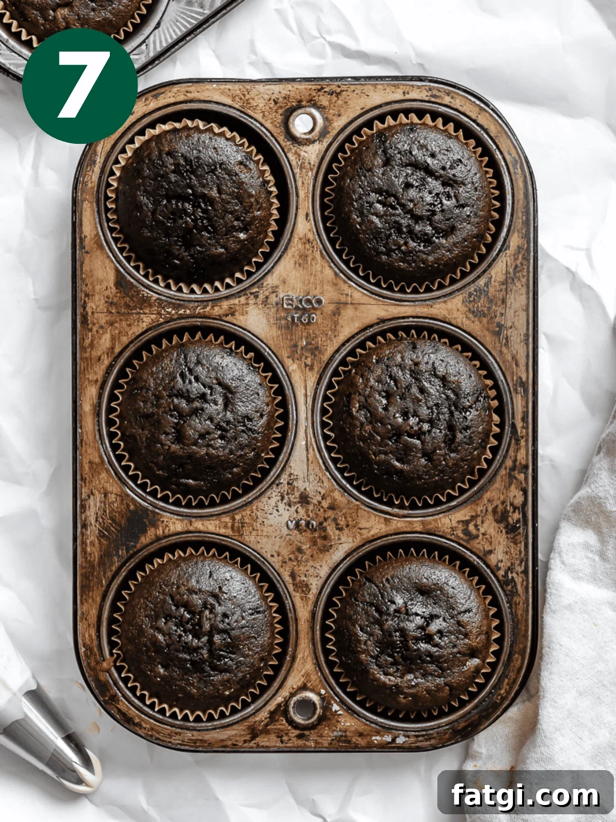 Mocha Coffee Cupcakes with Espresso Frosting 8 completed Easy Coffee Cupcakes in a muffin tin