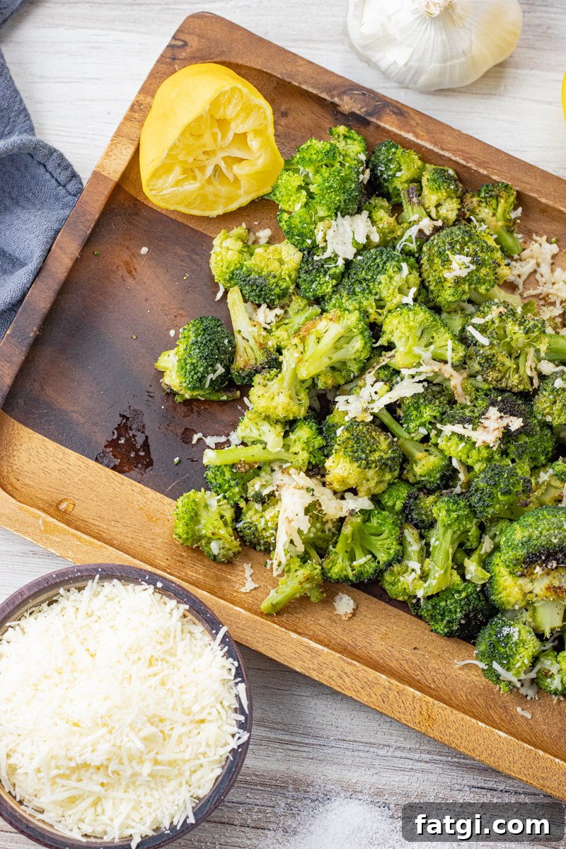 broccoli that has been roasted and topped with parmesan cheese