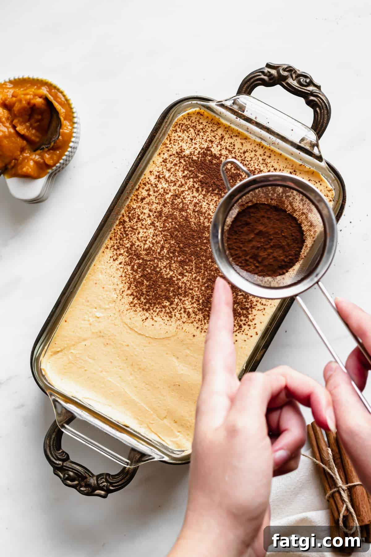 Pumpkin Chai Tiramisu Recipe 9 Cocoa powder and cinnamon dusted on top of the pumpkin chai tiramisu