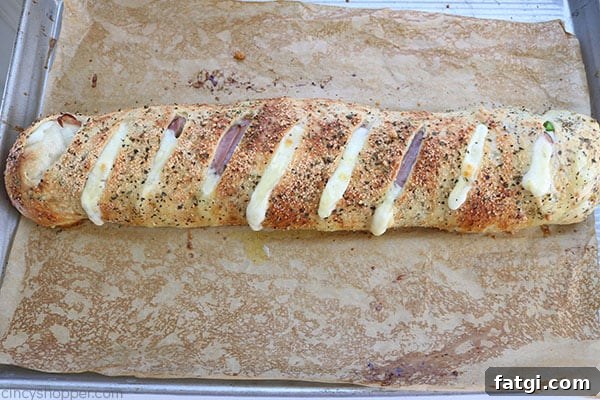 Easy Stromboli - Since we use store bought pizza dough, it comes together in no time at all. Load in your favorite toppings like ham, salami, provolone, mozzarella, peppers, onions, the combinations are endless.