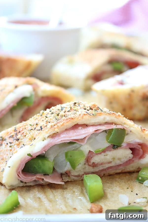 Easy Stromboli - Since we use store bought pizza dough, it comes together in no time at all. Load in your favorite toppings like ham, salami, provolone, mozzarella, peppers, onions, the combinations are endless.