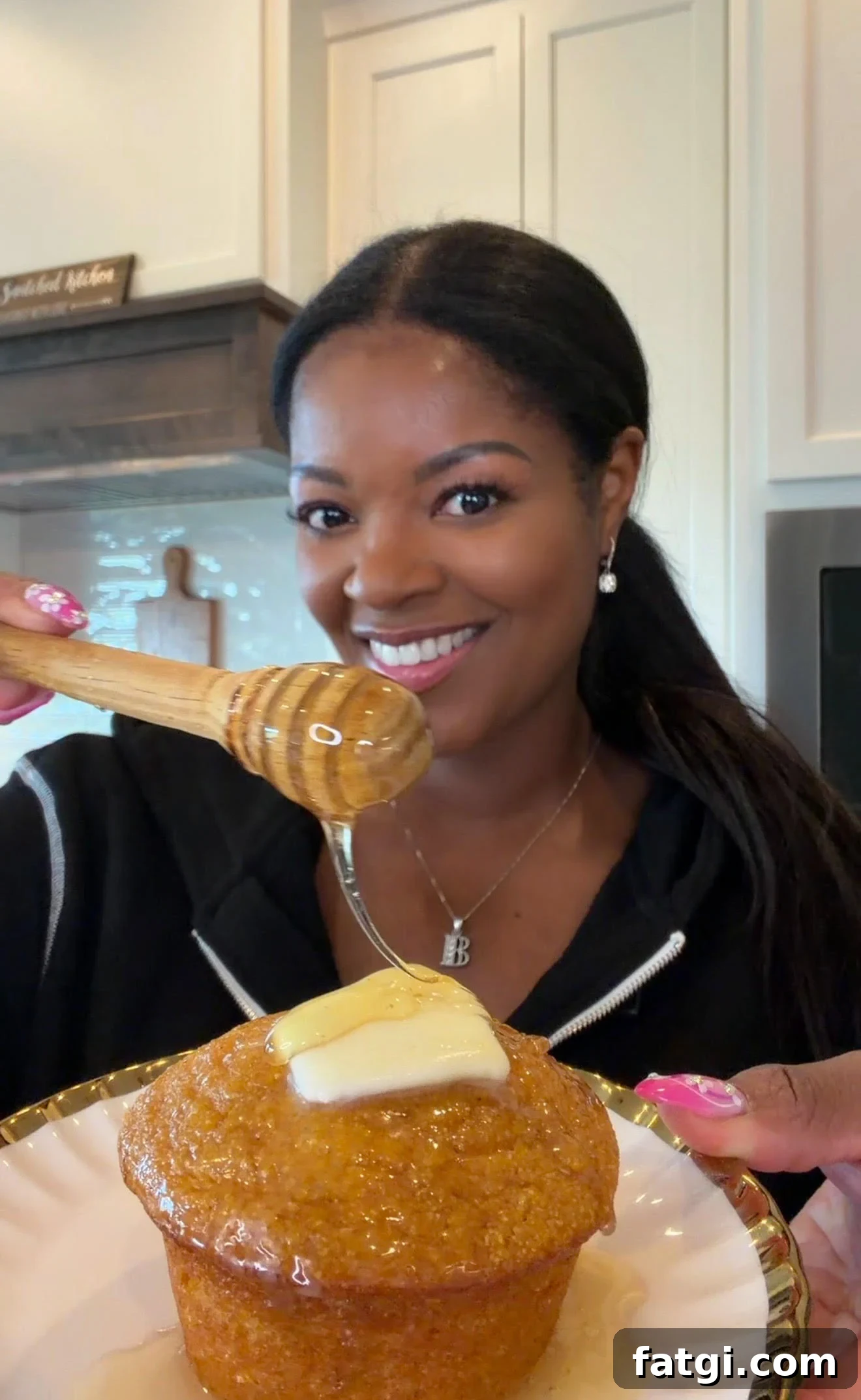 Sweet Potato Honey Cornbread Recipe 2 person holding sweet potato cornbread muffin and drizzling honey over it