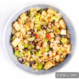 Mixed chickpea salad in a blue bowl.