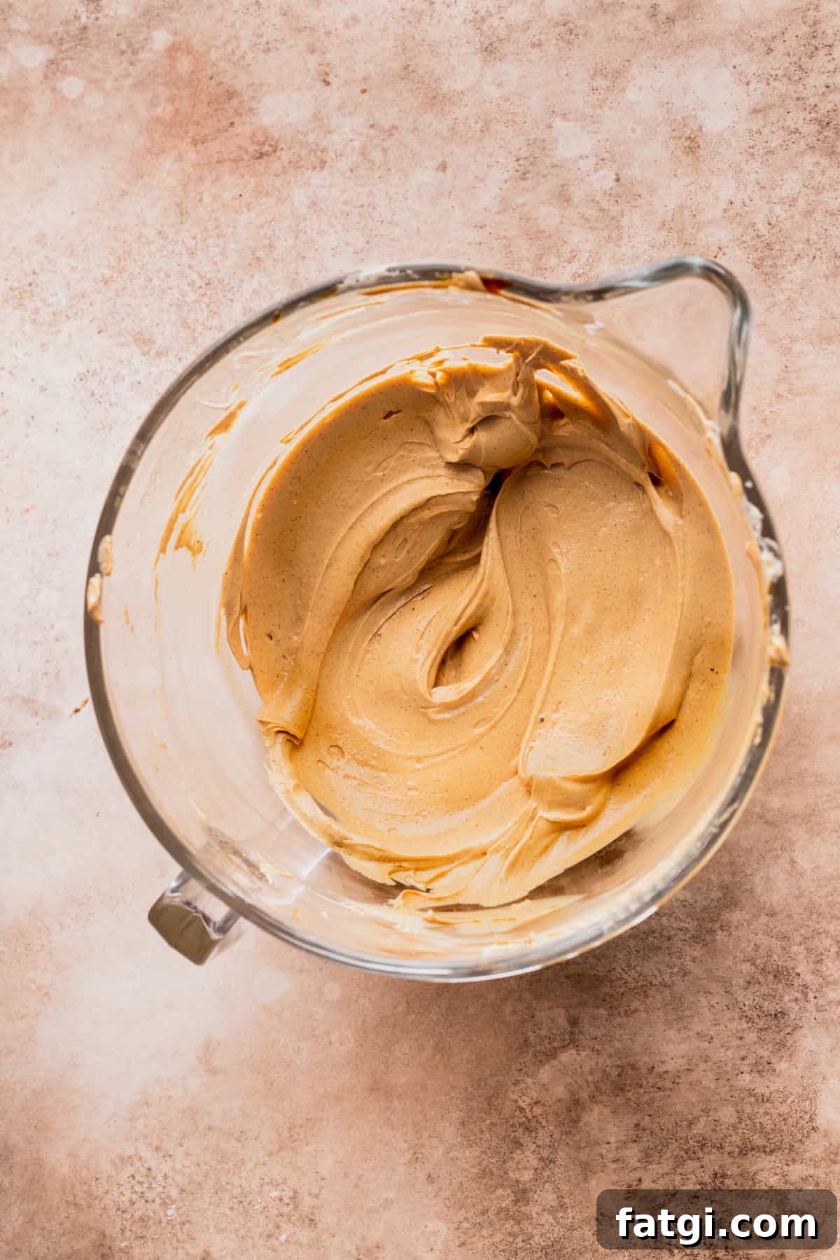 Cheesecake batter with no eggs in glass bowl.