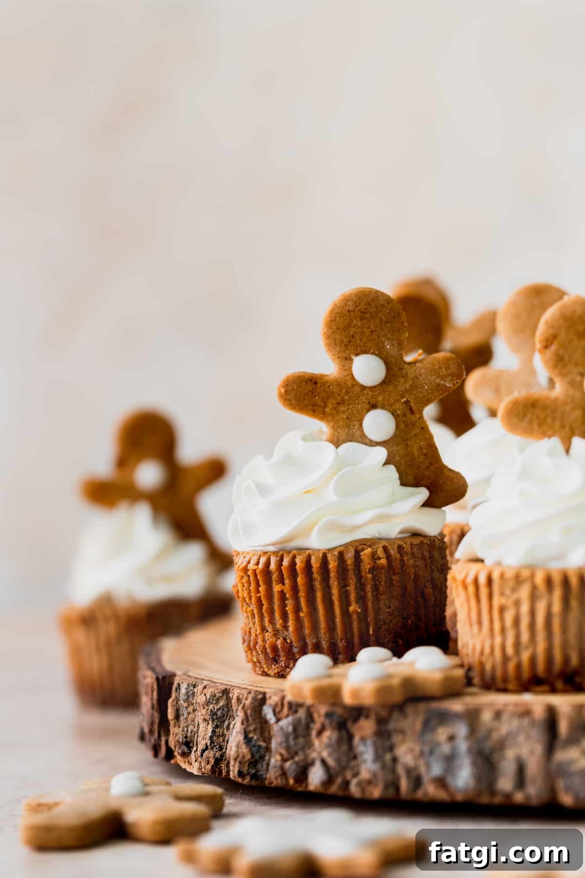 Mini gingerbread cheesecakes on a wooden board.