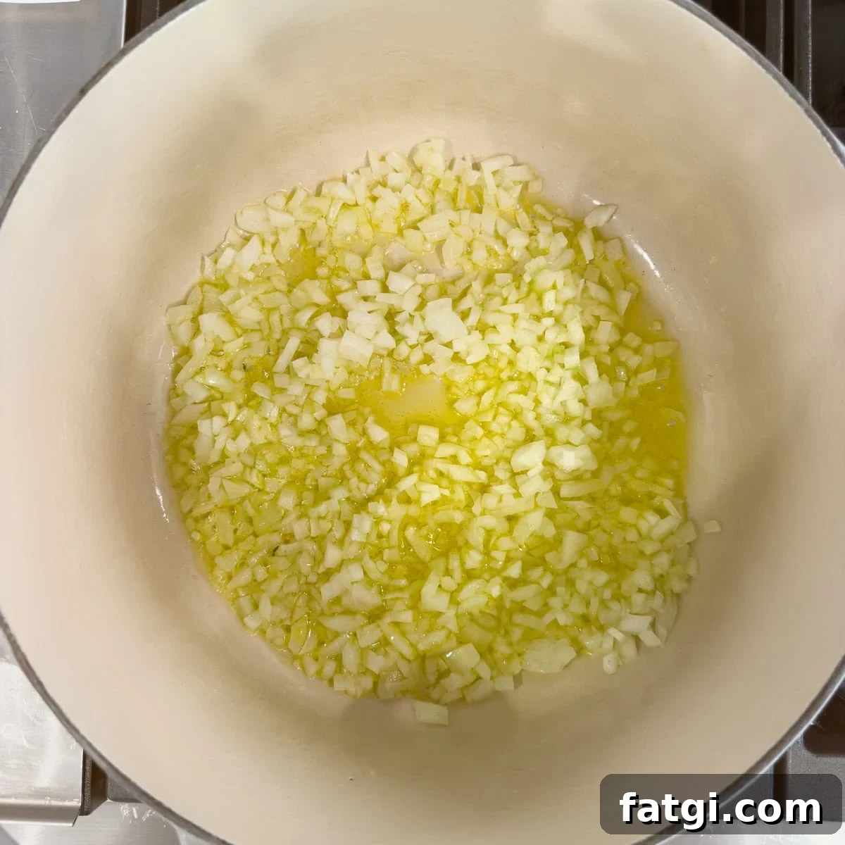 Sautéing onions and garlic in a dutch oven.