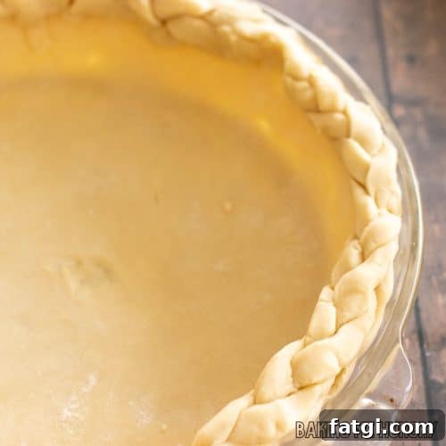 3 ingredient pie crust recipe in pie plate with braided edge