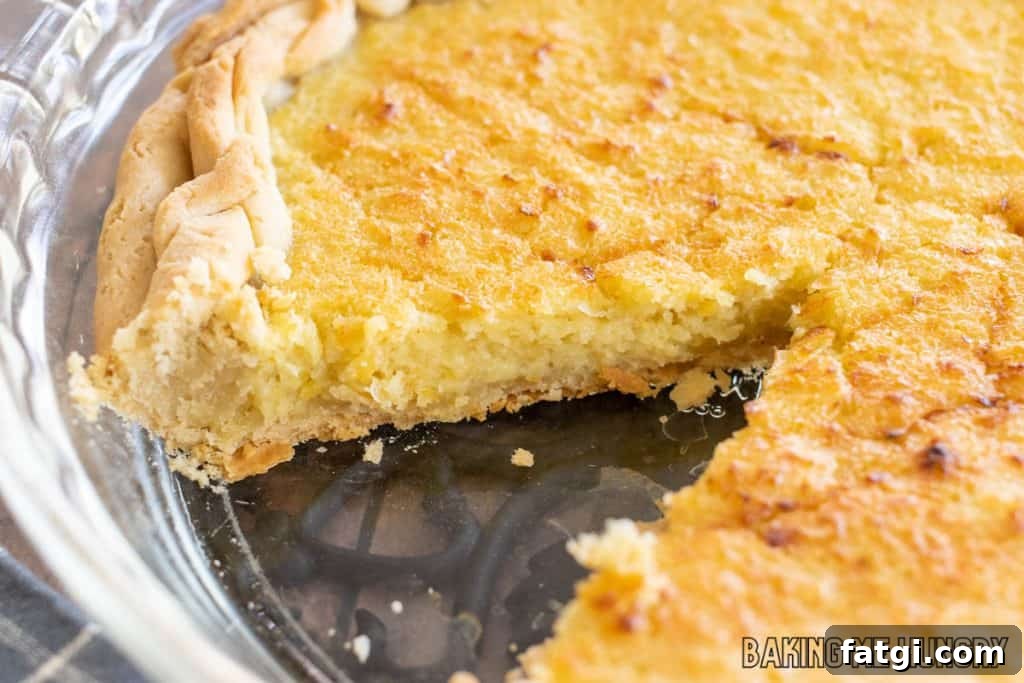 sweet corn pie in a pie plate missing a slice
