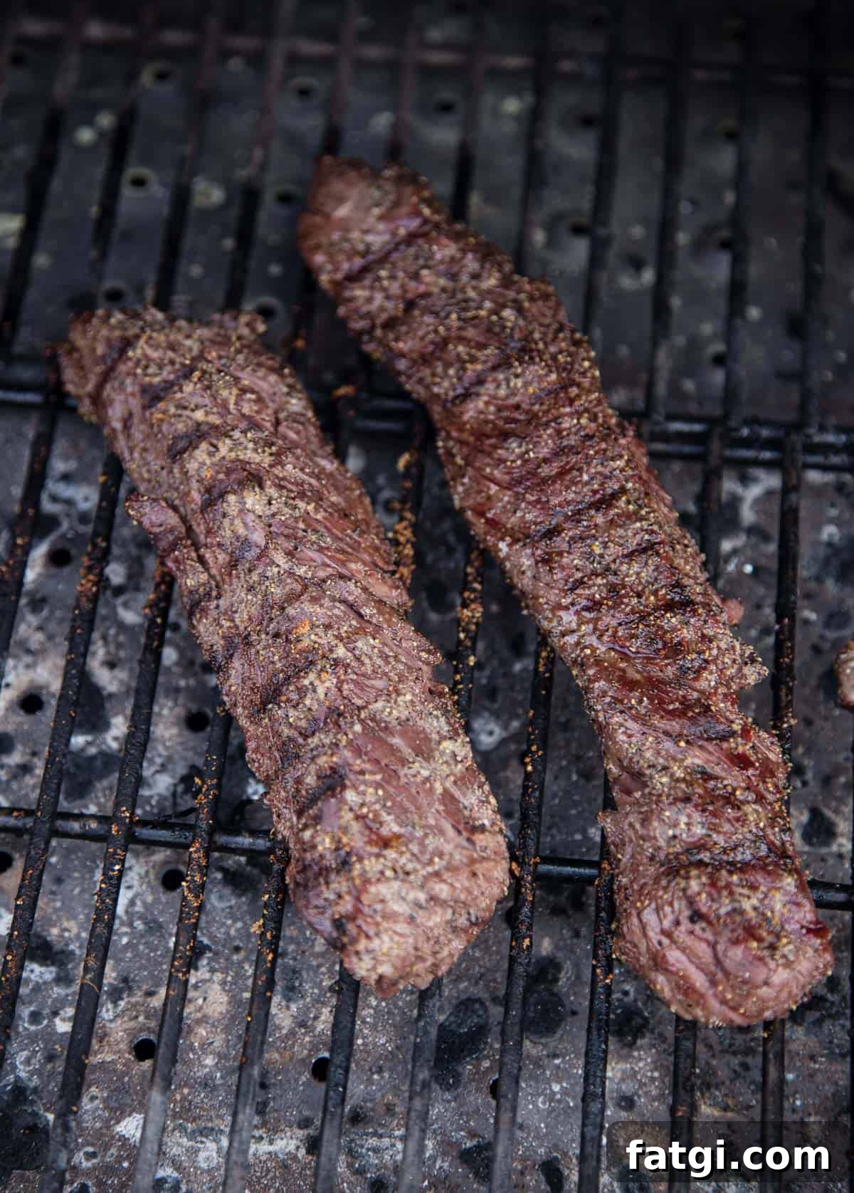 2 Hanger Steaks cooking on a grill