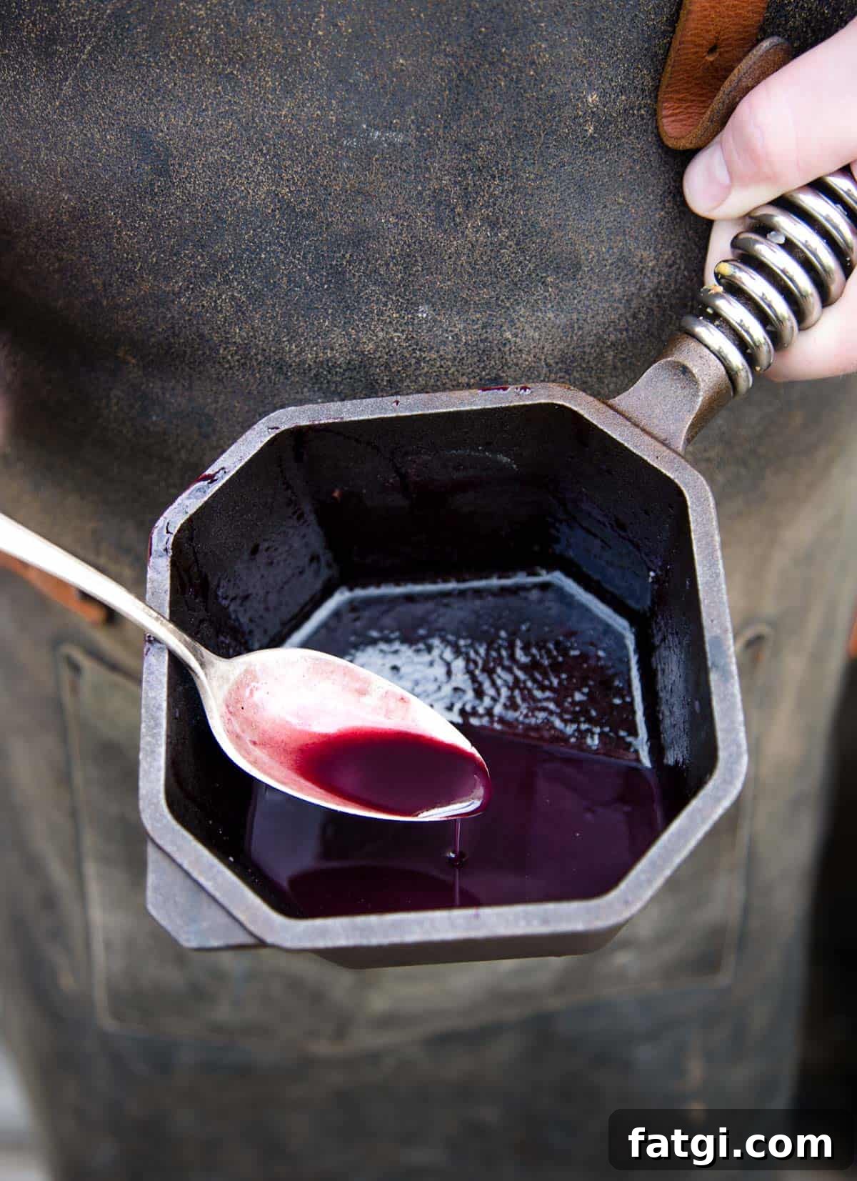 Pinot Noir wine and Marionberry reduction sauce in a small saucepan