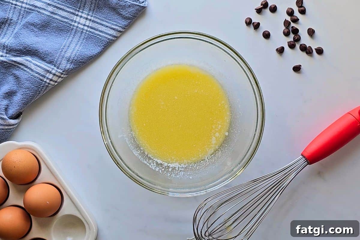 Melted butter after being whisked in glass mixing bowl.