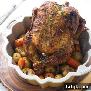 Herb Roasted Bundt Pan Chicken and Vegetables 10 Bundt pan with a roasted chicken and vegetables.