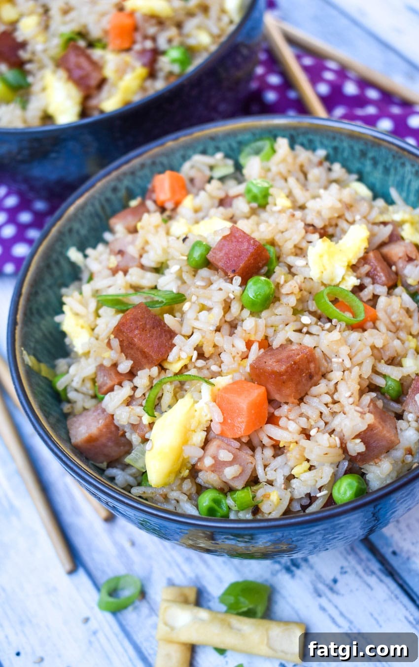 spam fried rice in a blue bowl