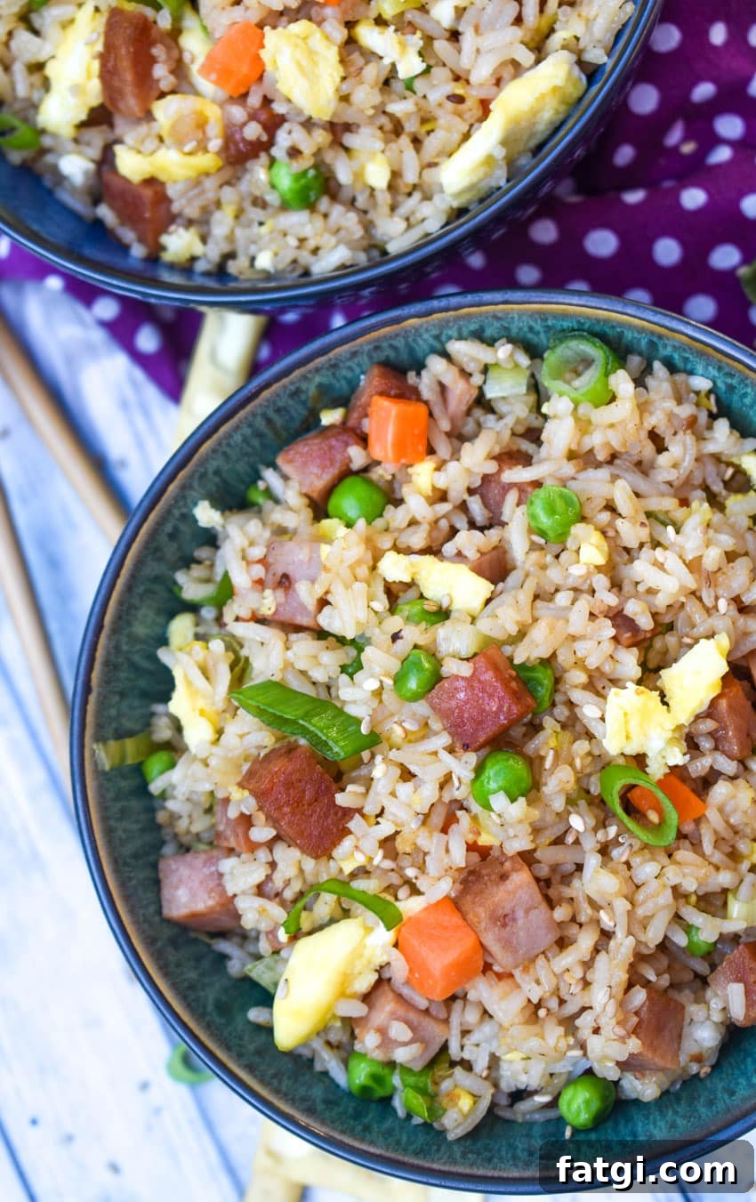 spam fried rice in two blue bowls
