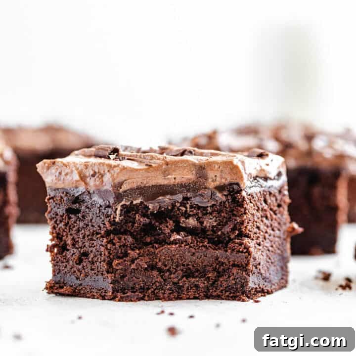 half eaten slice of chocolate cake in the foreground with multiple slices in the background