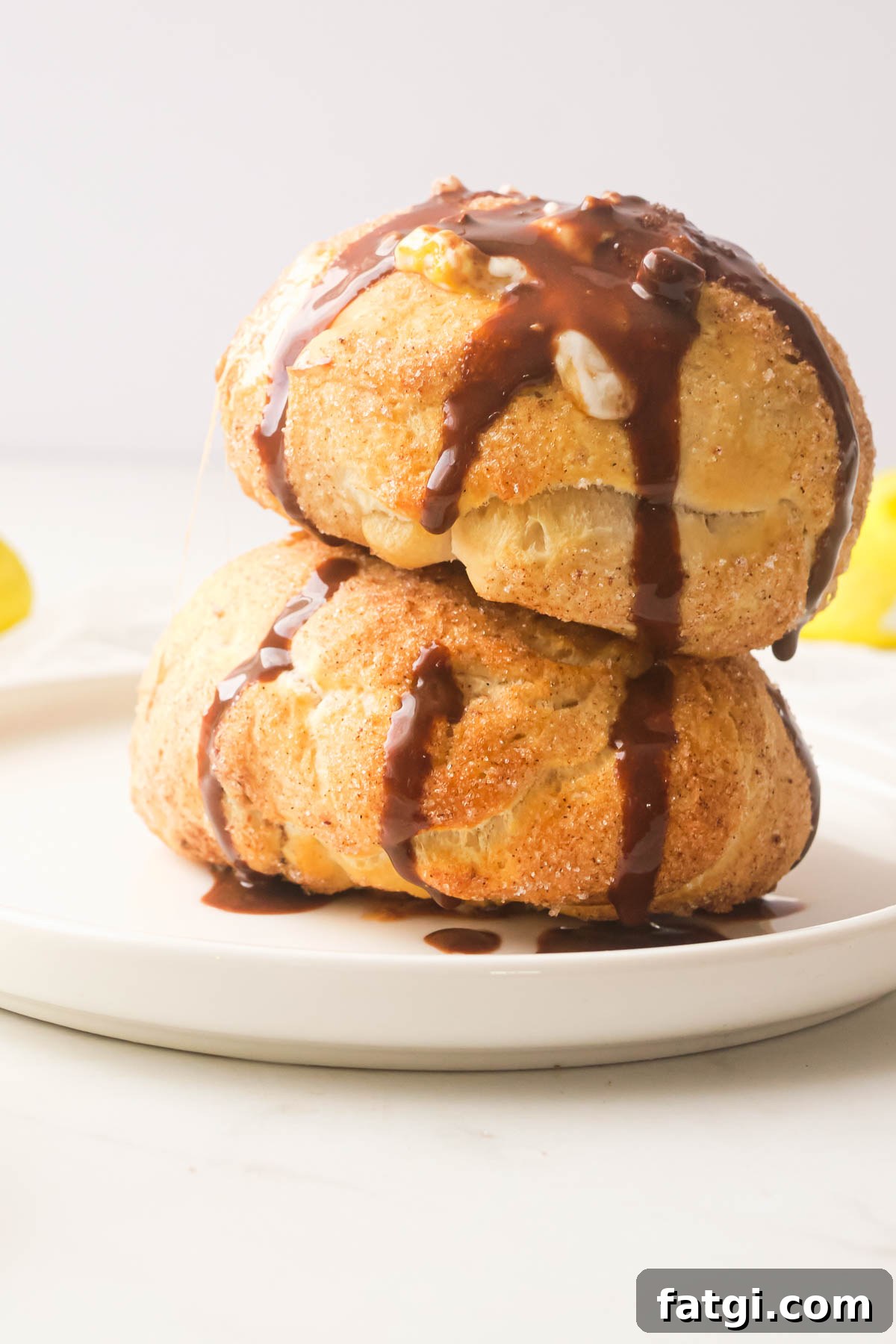 Air Fryer Peeps Crescent Rolls 4 two air fryer peeps rolls stacked on top of each other and topped with chocolate sauce