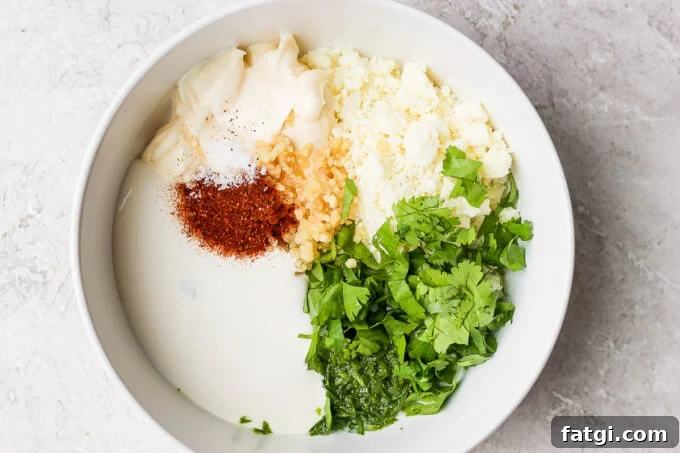 ingredients for mexican street corn sauce in a bowl