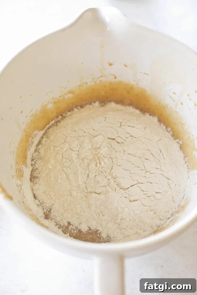 Flour, baking soda and salt mixed with browned butter and sugars. 