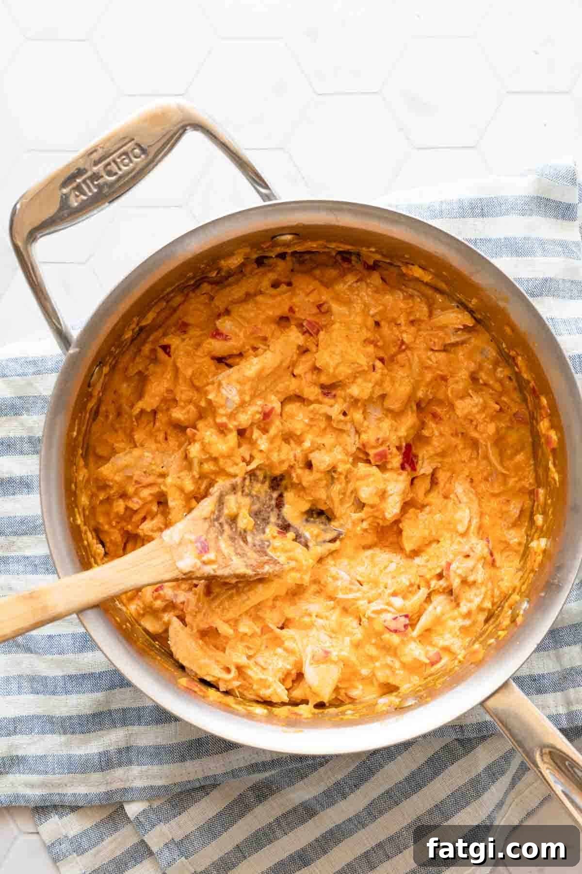 Greek yogurt buffalo chicken dip in saucepan before yogurt is added.