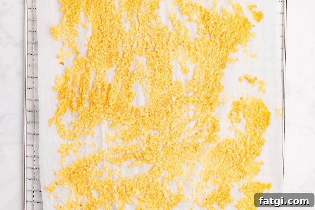 Make Garlic Powder at Home Using a Dehydrator 6 Chopped garlic spread on dehydrator tray with parchment.